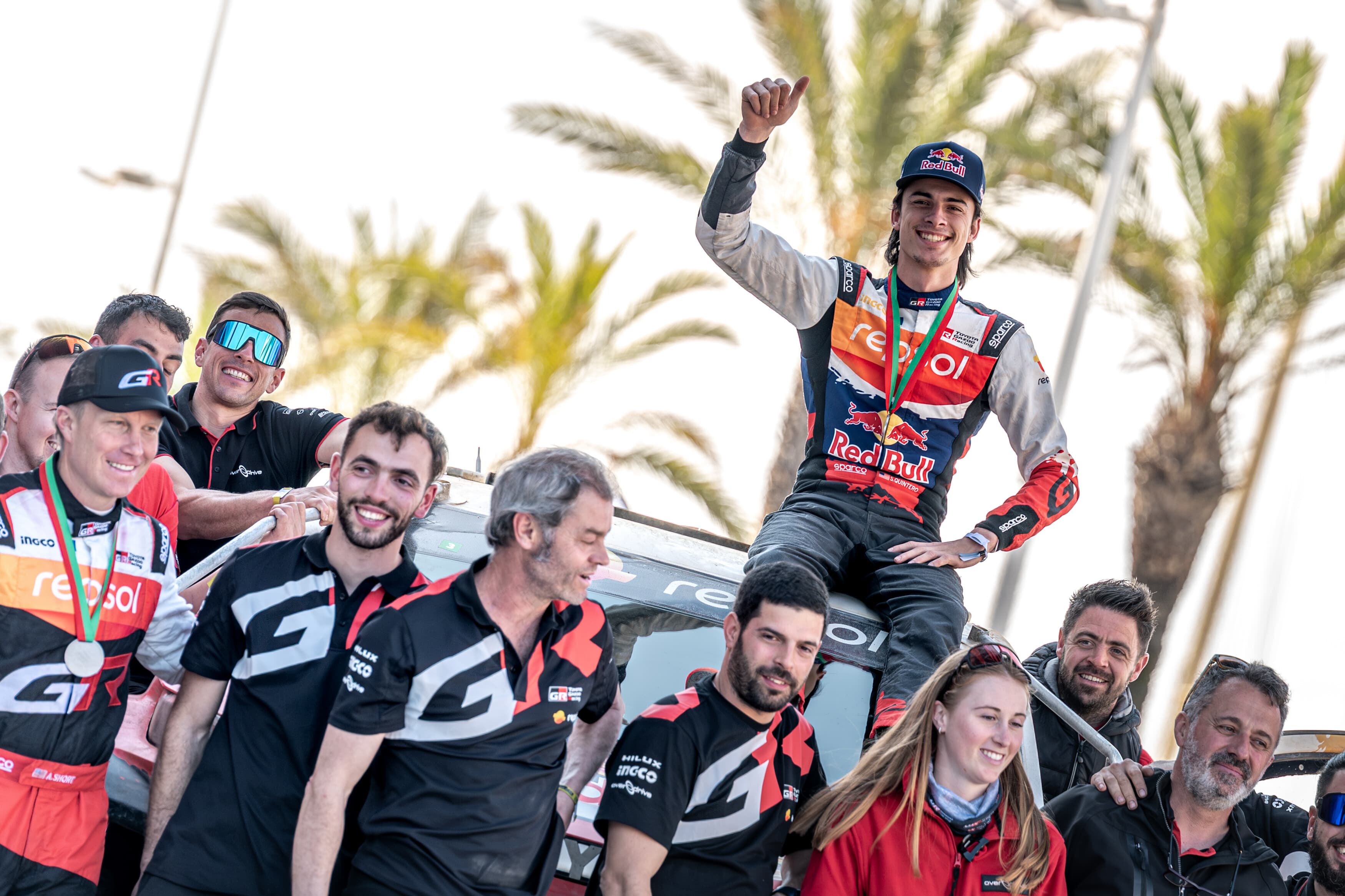 Seth Quintero celebrating on the podium with his team